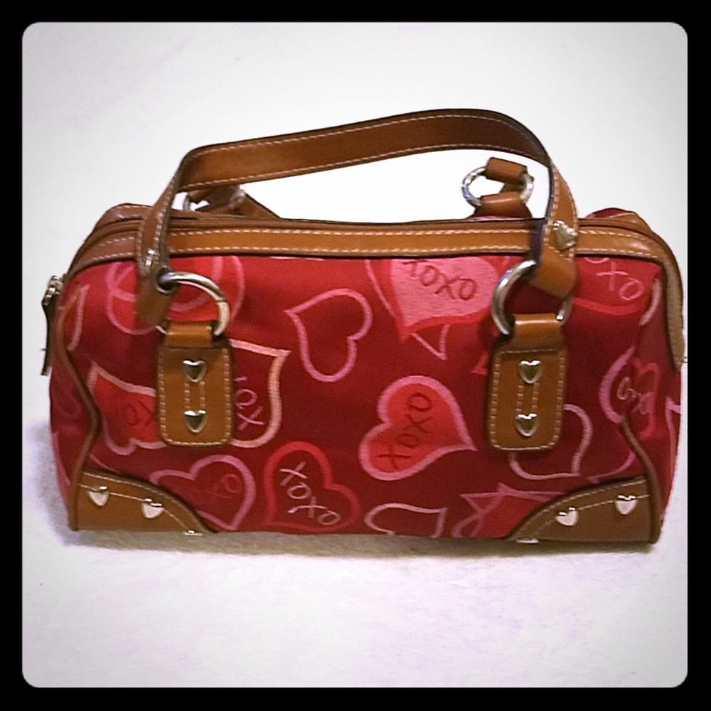 Red purse with tan straps